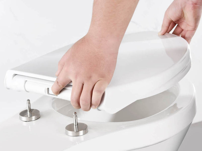 How to install a toilet seat to a toilet pan with smaller holes?